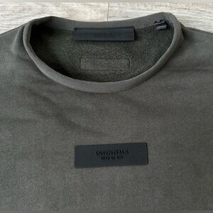 Fear Of God Essentials sweater with pockets. Brand new. NWT and bag.